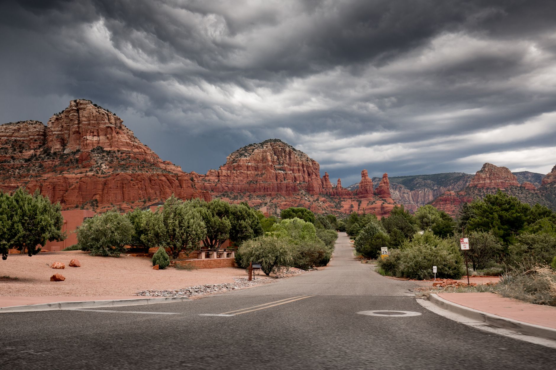 Beautiful geological formations and stormy skies in Sedona, Arizona, highlighting the dramatic landscape.